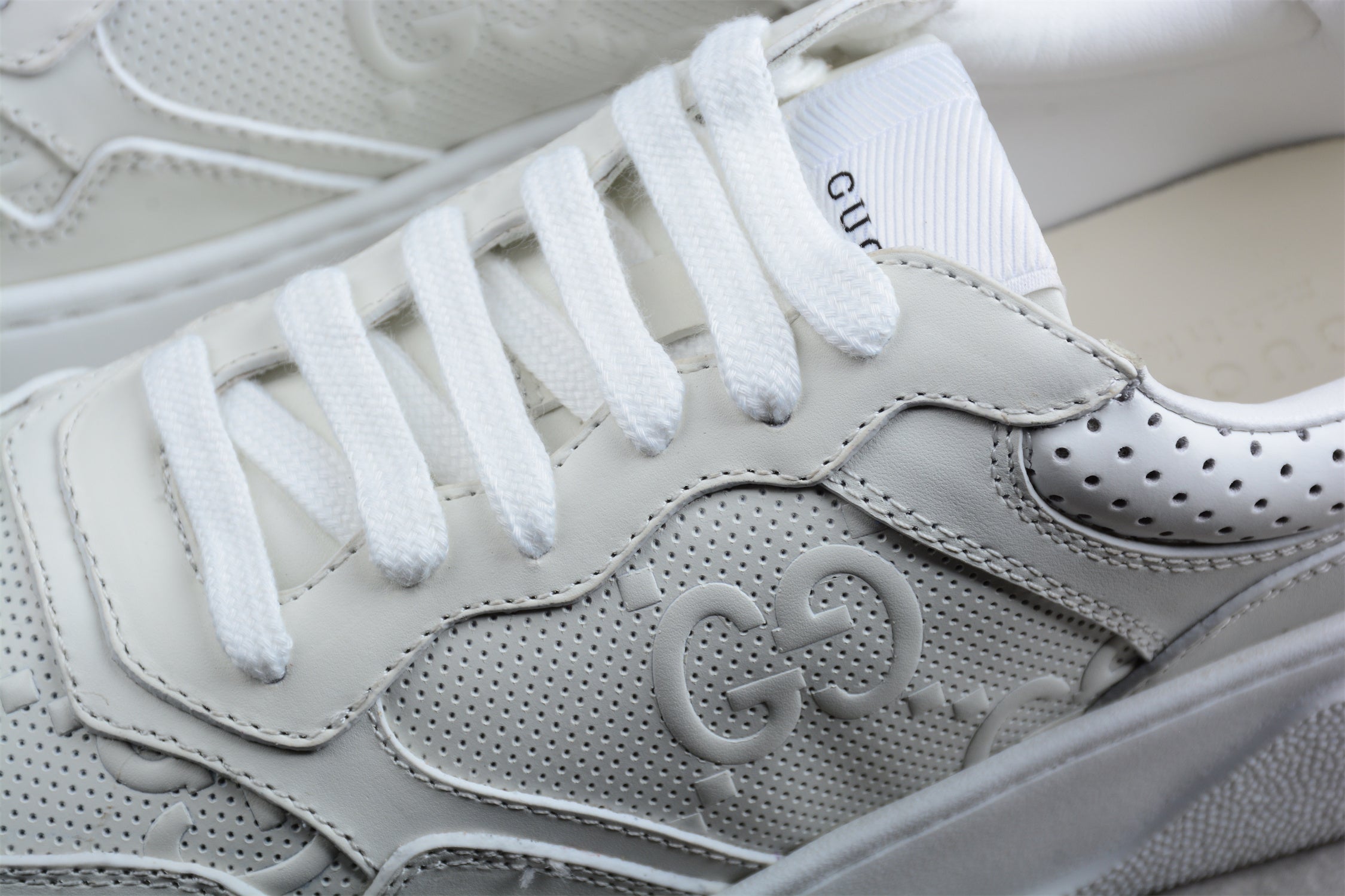 GucciUnisex Embossed GG Logo - White